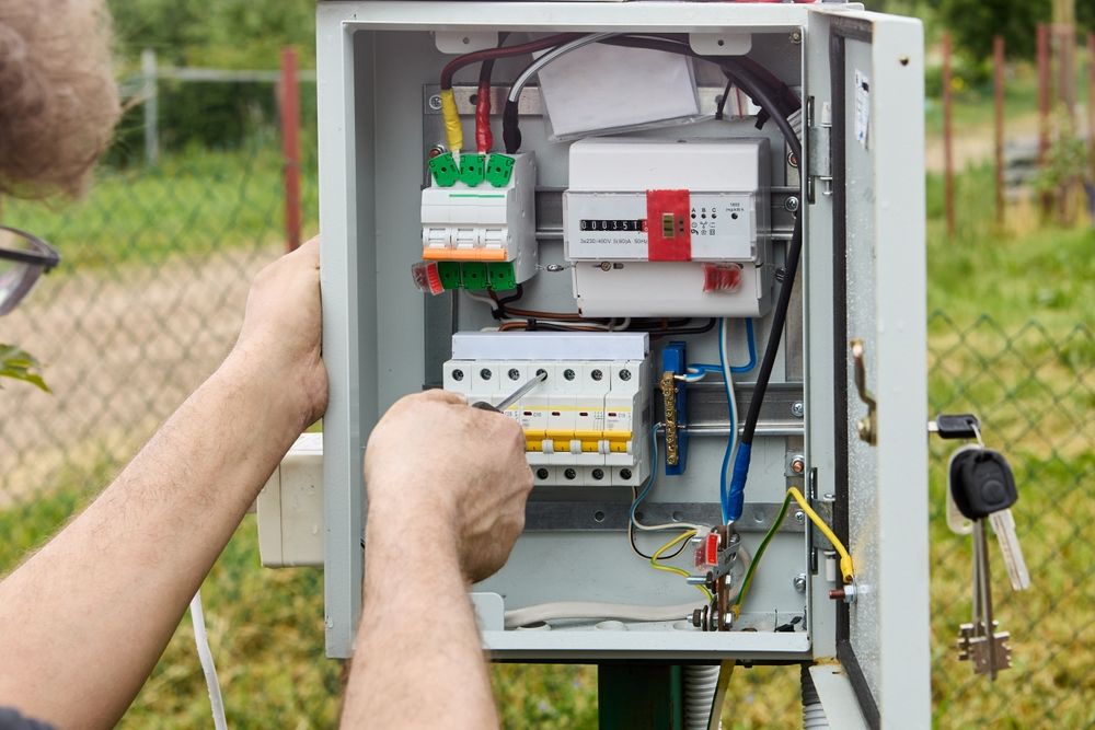 Licensed electrician installing a new switchboard on the Gold Coast