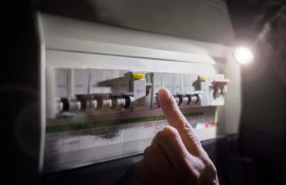 Licensed electrician carrying out emergency repairs on the Gold Coast